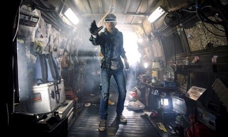 Person in visor standing inside a smoke-filled, equipment-packed vehicle